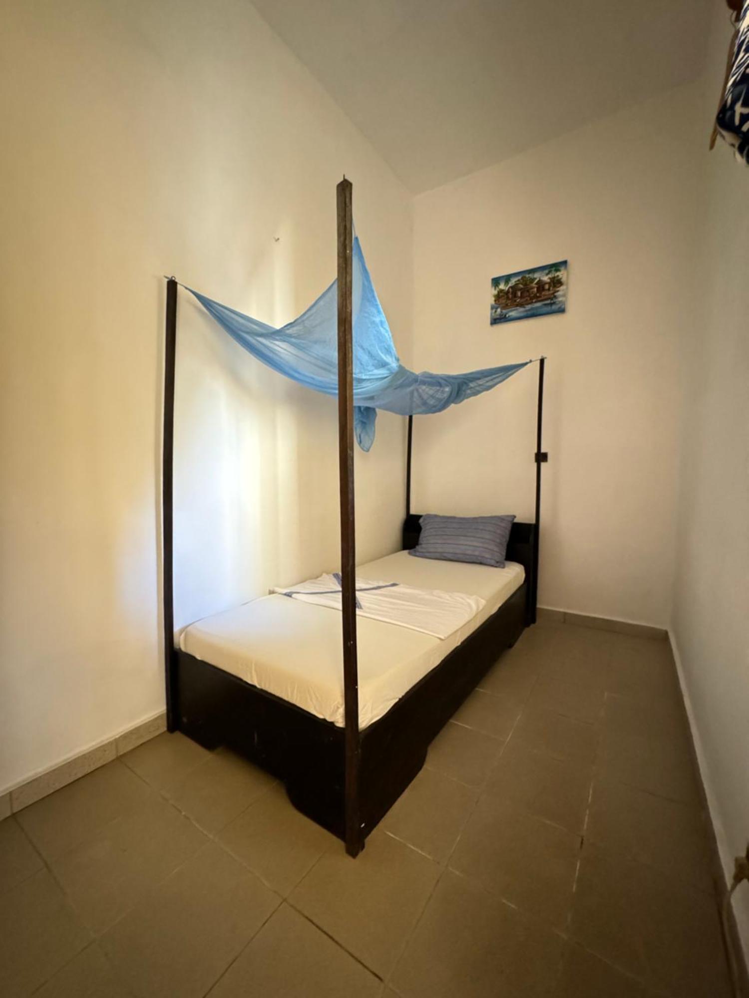 Guesthouse Cocotiers Котону Экстерьер фото